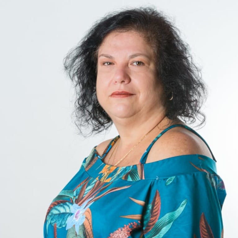 a woman with a blue dress and a necklace