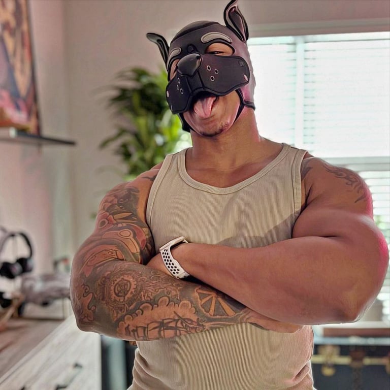  man poses in a pup mask.