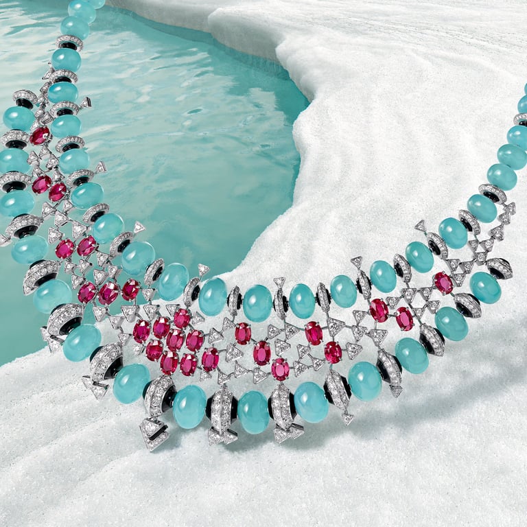 Luxury Cartier necklace featuring turquoise and ruby gemstones.