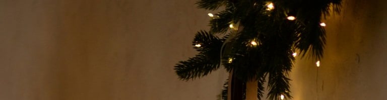 a christmas tree with candles and candles on a dresser