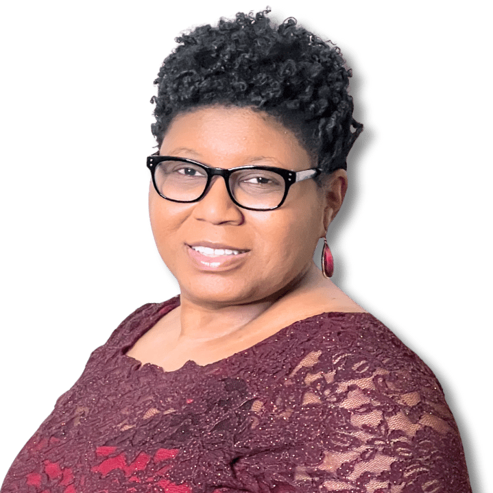 Tameka Chapman smiling in burgundy dress and black glasses