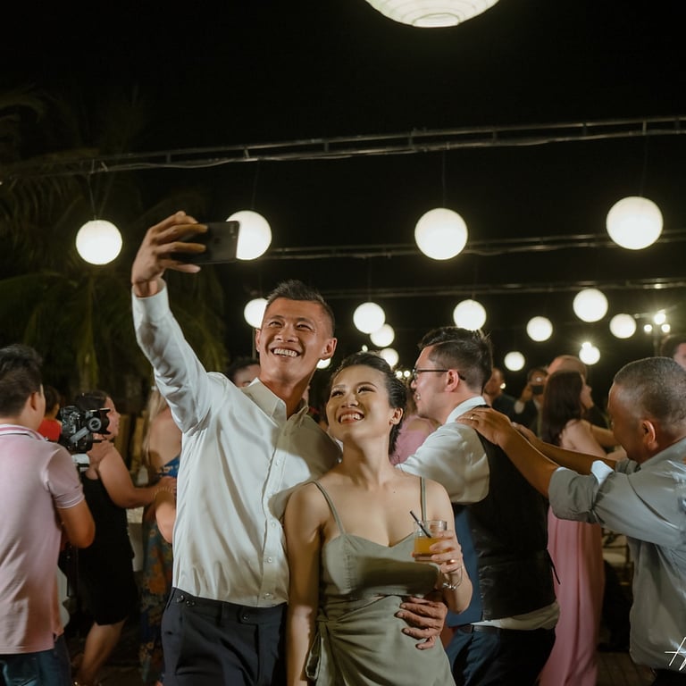 a man and woman dancing at a party