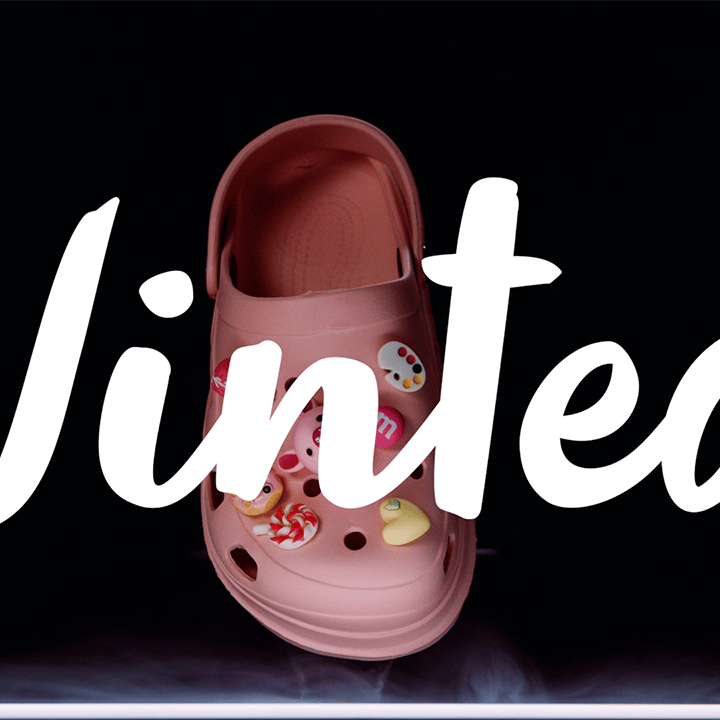 a pair of pink shoes with a pink flowered shoe