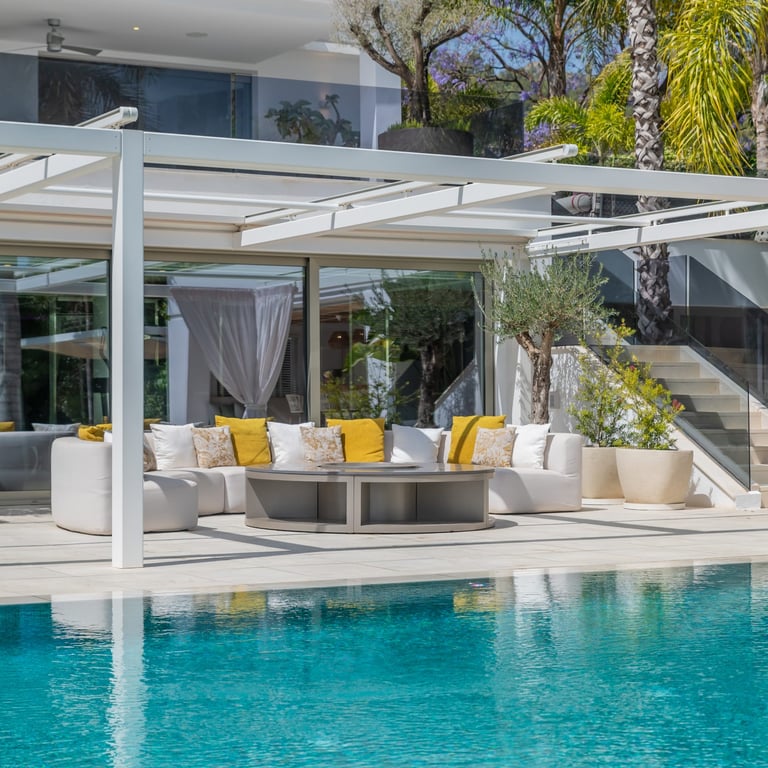 Pool area at Villa Serenity featuring modern furnishings, sunbathing lounges, and chill-out areas