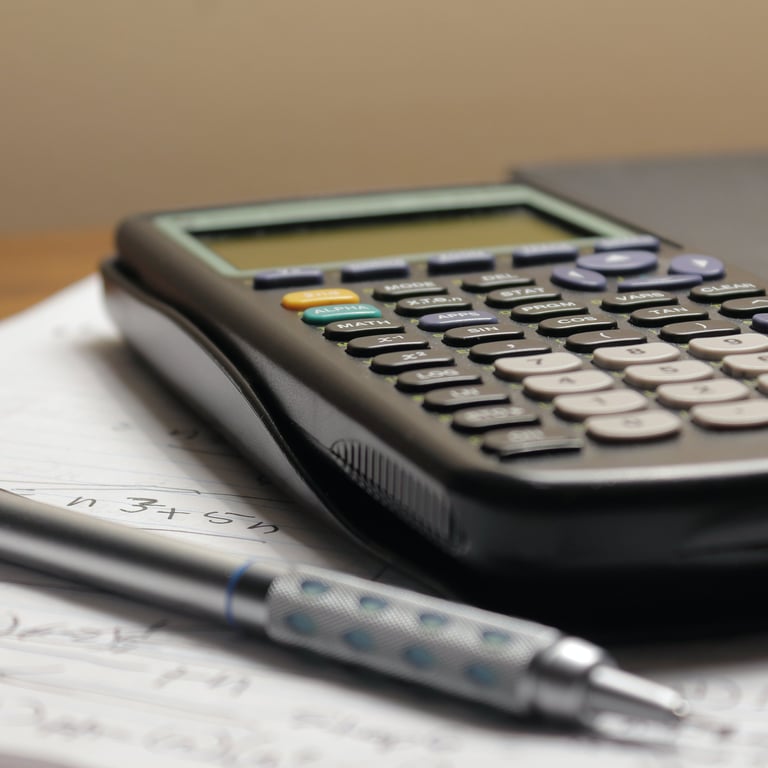 calculator, pen and notepad