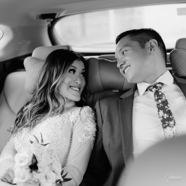 a bride and groom in a car