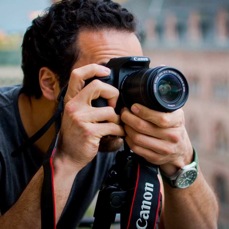 man holding a digital camera