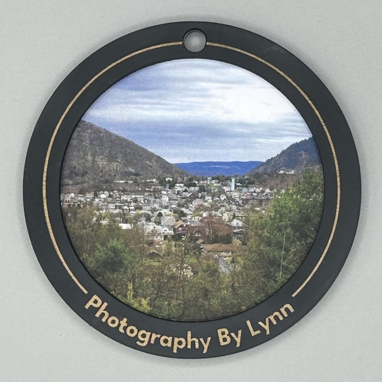 laser cut and engraved wooden lens ring with photo of Palmerton inside