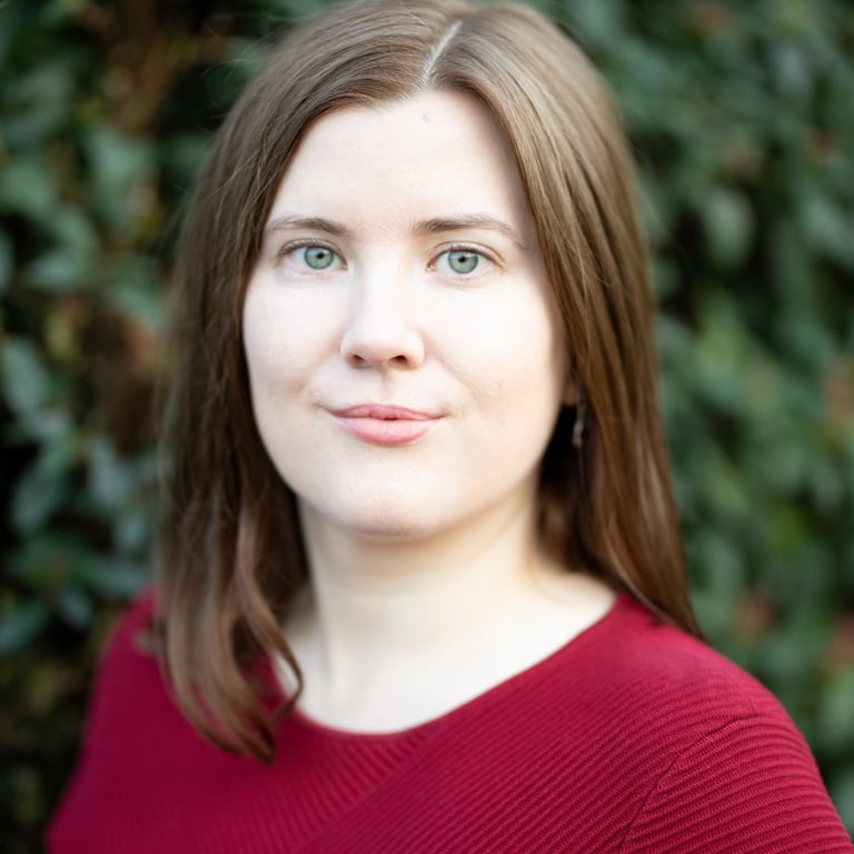 Adept Mediation professional compassionate female mediator looking at a client