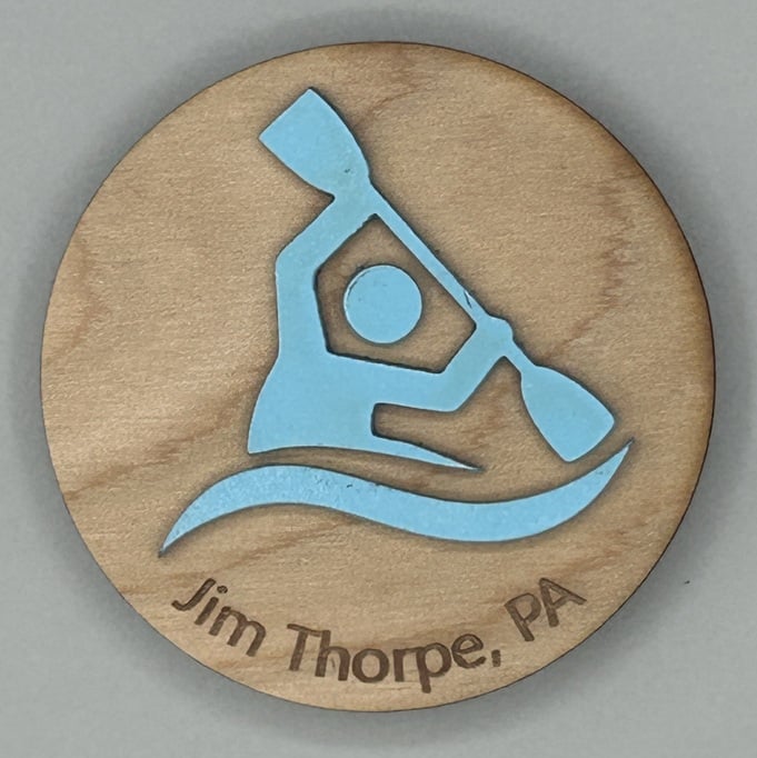 laser engraved and painted wooden souvenir magnet showing kayaker