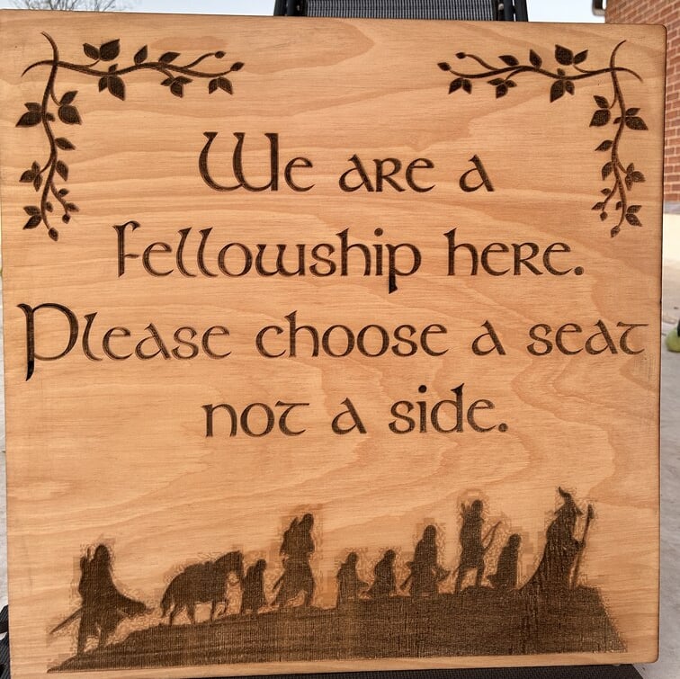 laser cut and engraved lotr fellowship wooden sign for a wedding