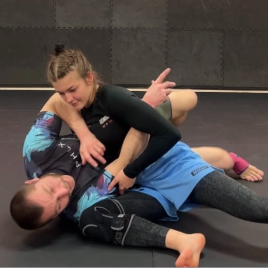 Personal Trainer teaching young Woman Self Defense
