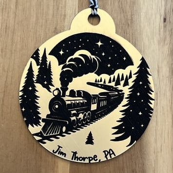 laser engraved acrylic ornament of steam train in winter