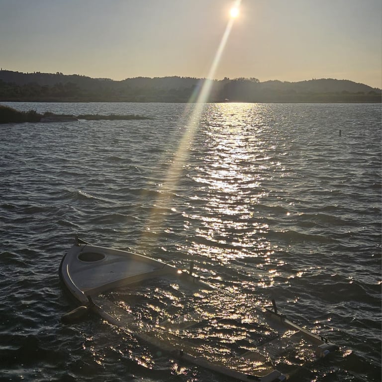 a surfboarder is sitting on the water