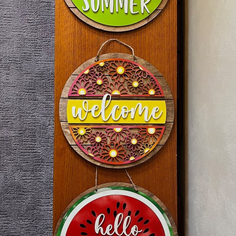 laser cut and colorfully painted wooden door or wall hangers