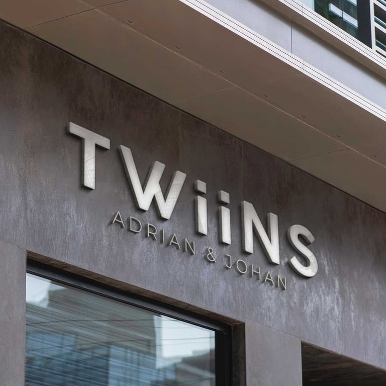 a building with a sign that says twins and luxury logo