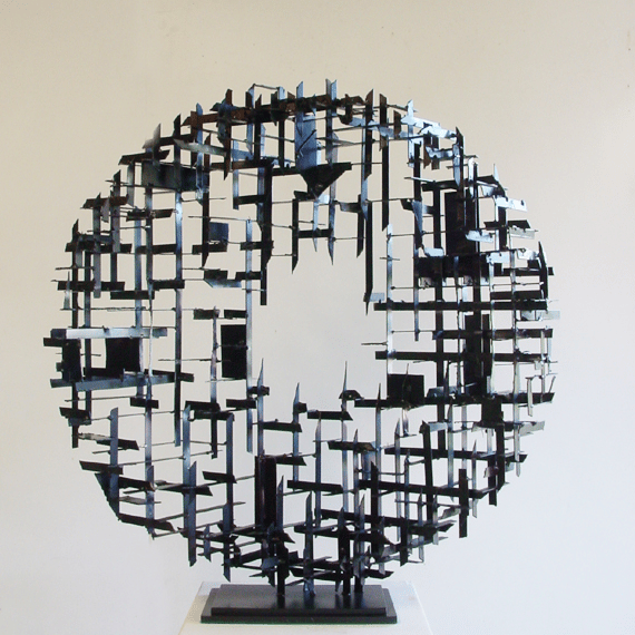 a steel cross-hatched  circle sculpture  