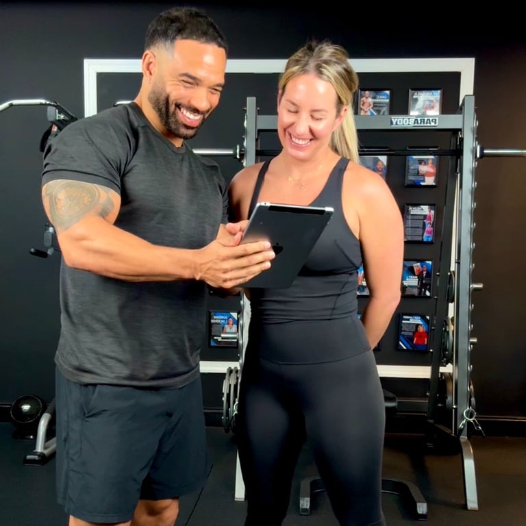 fitness trainer nutrition counseling with woman