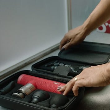 Oyeet NEX Pro portable massage gun for deep muscle relief, providing percussive therapy