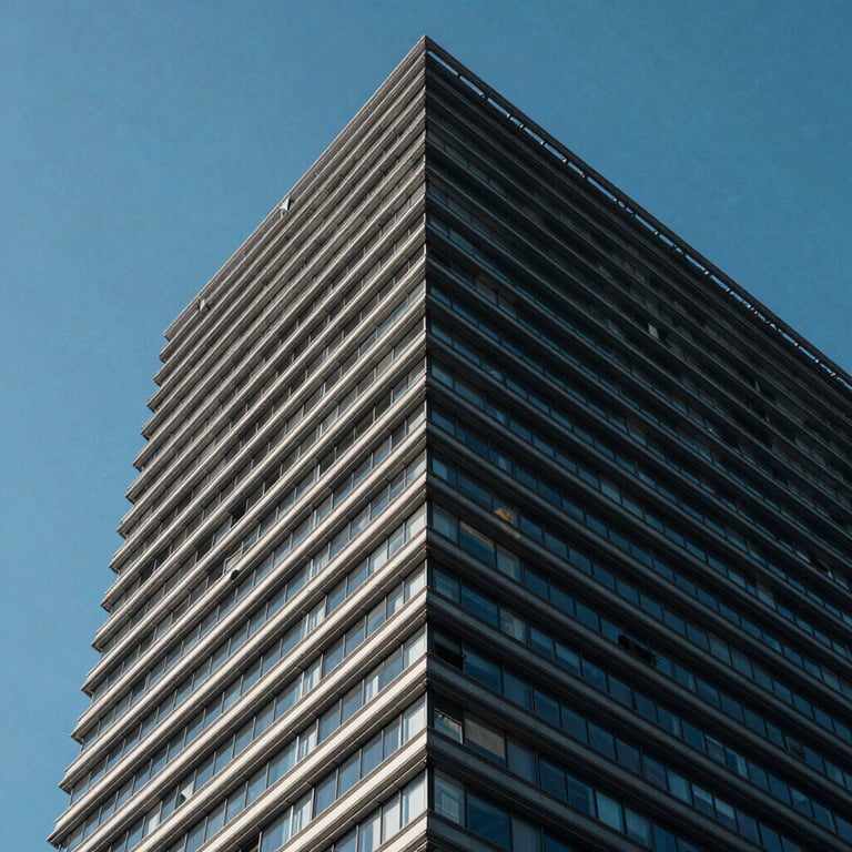 Sleek architectural building detail under a clear blue sky, emphasizing precision and engineering excellence.