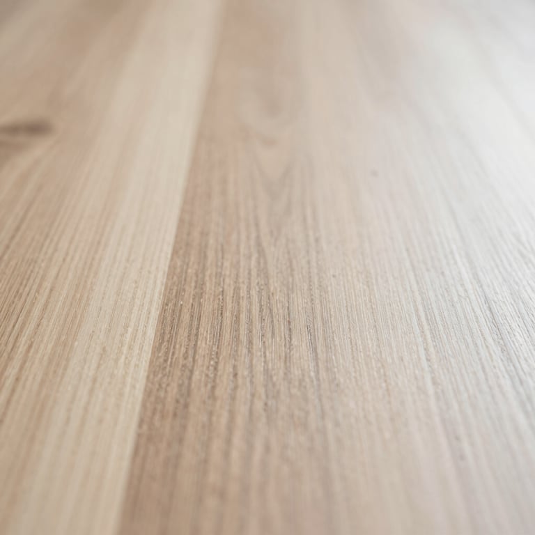 Macro shot of smooth oak wood grain with a light natural finish, soft shadows, reflecting a palette of #BCA99D and #F8F4ED.