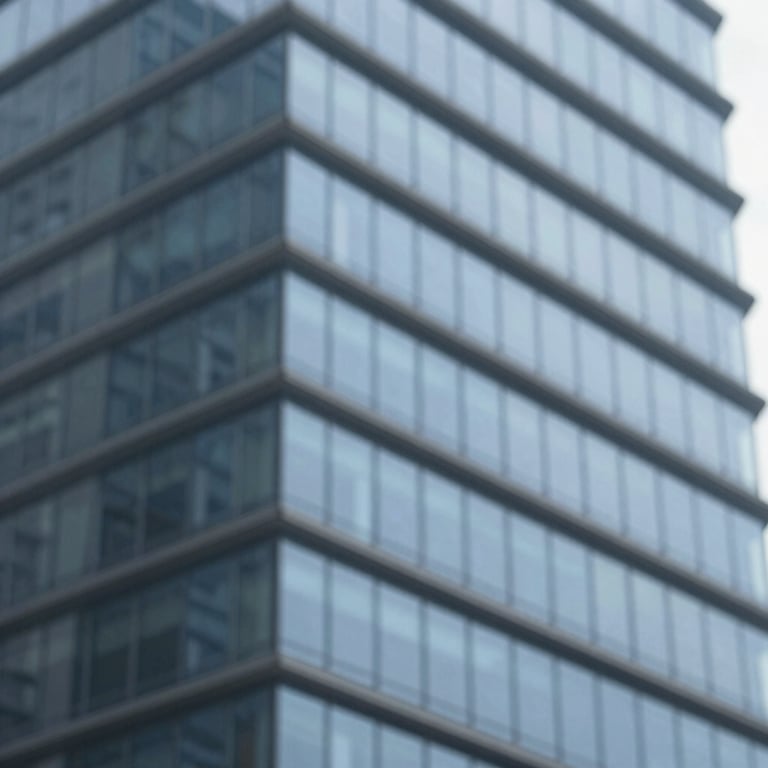 A close-up of a modern architectural building with clean glass lines and blue reflections in the style of #4E7B99.