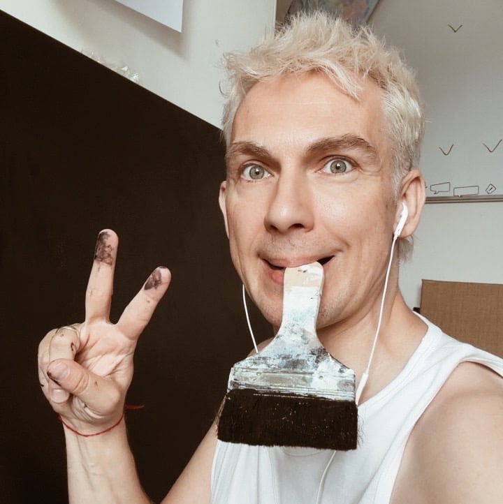 man holding brush in his mouth