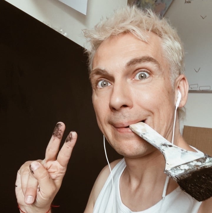 man holding brush in his mouth