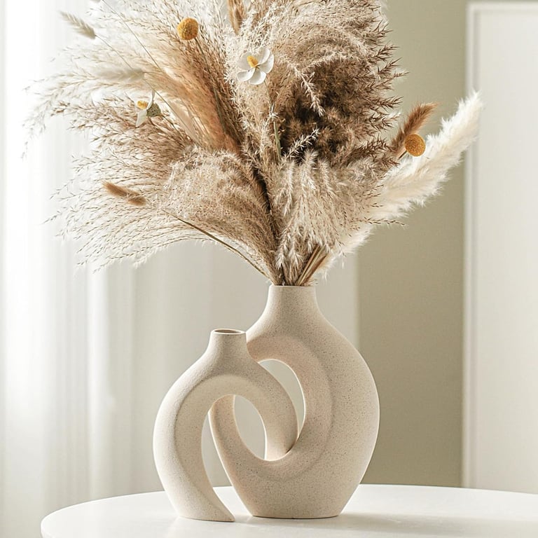 Modern ceramic vase set of 2 styled with dried pampas grass on a table, featuring neutral home decor in minimalist interior.
