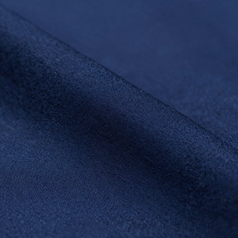 Macro shot of a high-quality navy blue (#283645) fabric texture with a subtle weave, professional studio lighting.