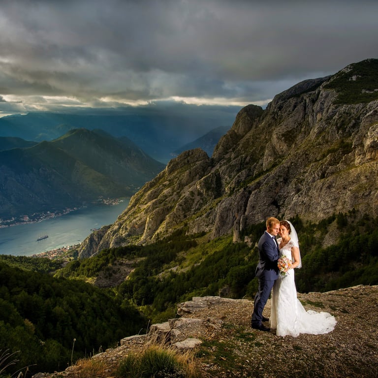 Wedding couple on the mountain above Kotor, with view of Boka bay