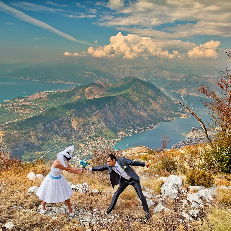 Wedding couple with wedding flowers over the Boka Bay above Kotor