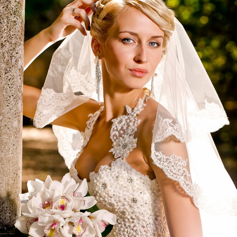 Professional bride portrait Montenegro - Beautiful wedding dress lace veil with flowers rustic stone wall backdrop