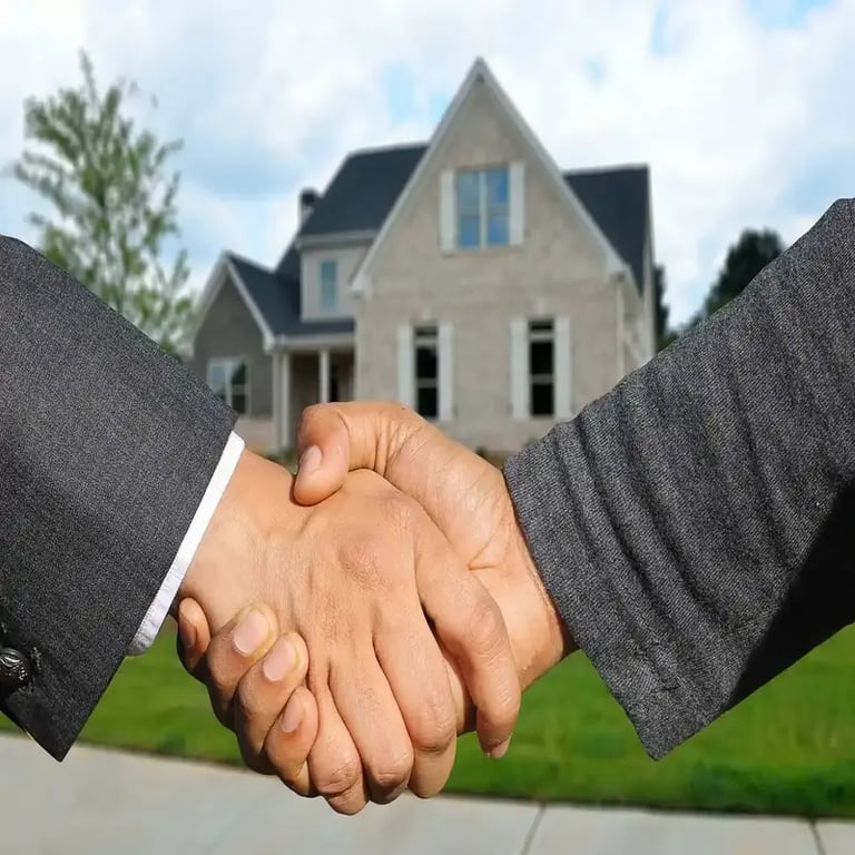Buisness partners shaking hands for a real estate joint venture project