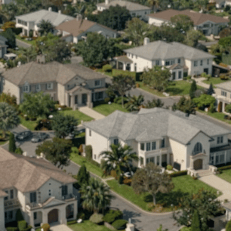 A stunning modern kitchen with white marble countertops and navy blue cabinetry (#1B2A3B), professional lighting, high-end stainless steel appliances.