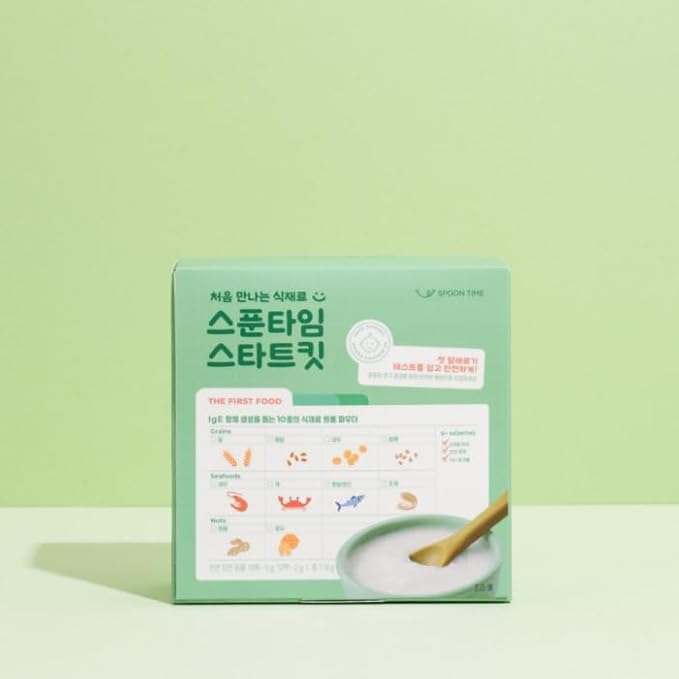 a box of rice pudding with a wooden spoon and a wooden spoon