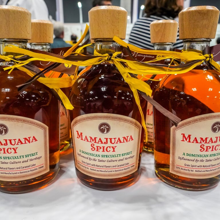 Bottles of Dominican Mamajuana Spicy on display at local market or festival