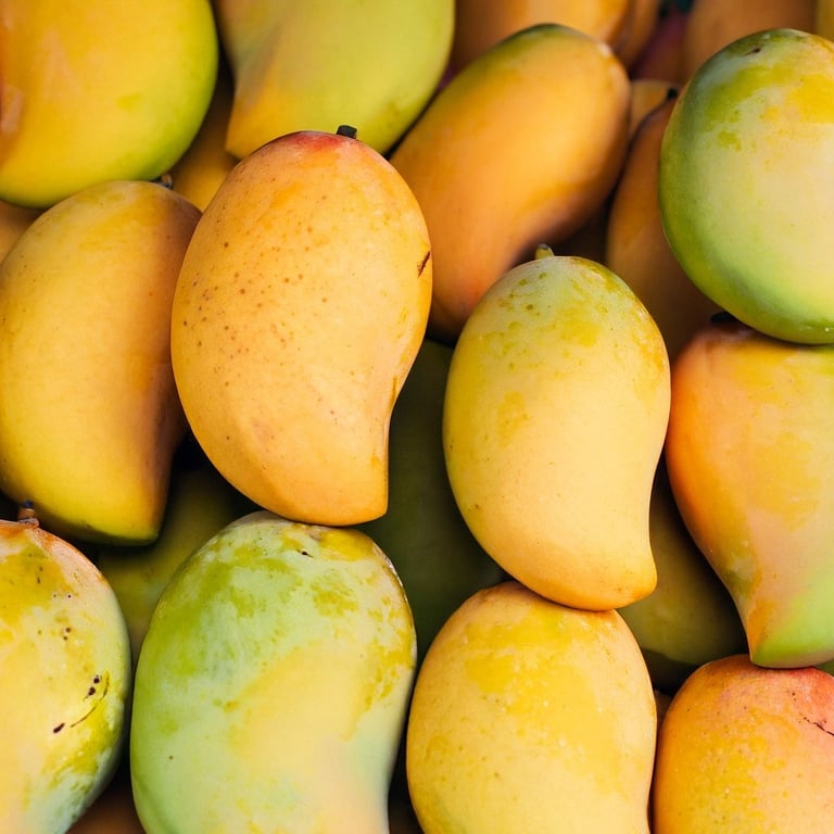 Fresh ripe mangoes at a local market in the Dominican Republic, one of the most popular tropical fruits."