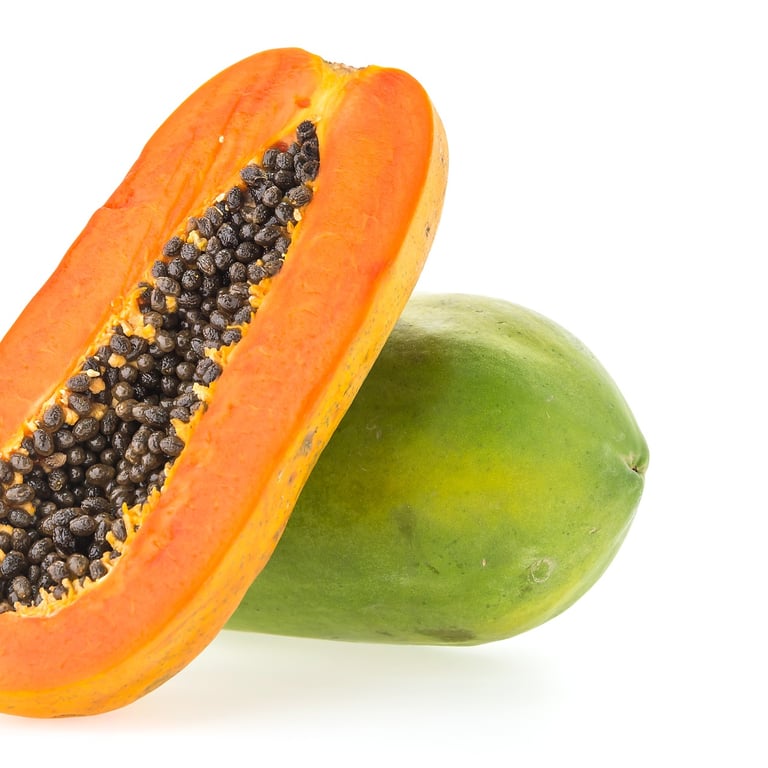 Fresh papaya (lechosa) with bright orange pulp and black seeds