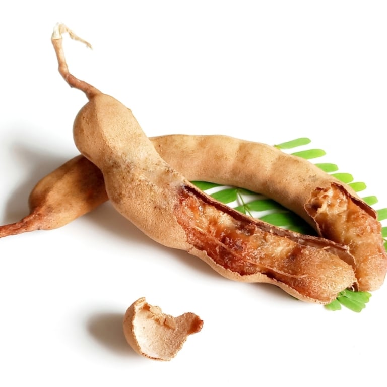 Ripe tamarind pods with pulp exposed