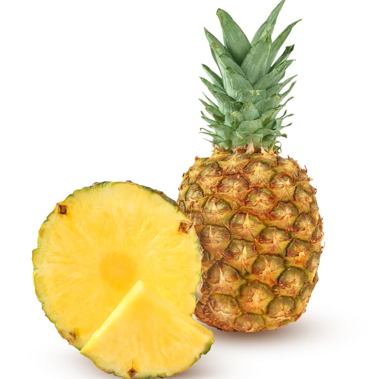 Fresh Dominican pineapple with slices showing its sweet yellow flesh
