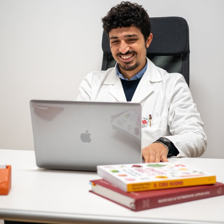 a man in a lab coat sitting at a desk