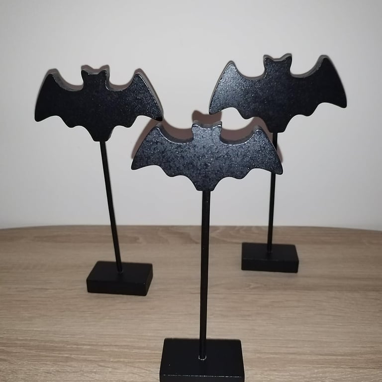 Three black wooden bat figurines on stakes with bases, Gothic Halloween tabletop decoration 