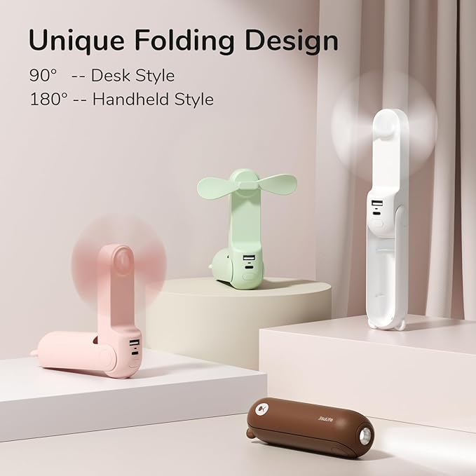 JISULIFE Handheld Mini Fan in pink – a compact, 3-in-1 portable fan with a power bank and flashlight