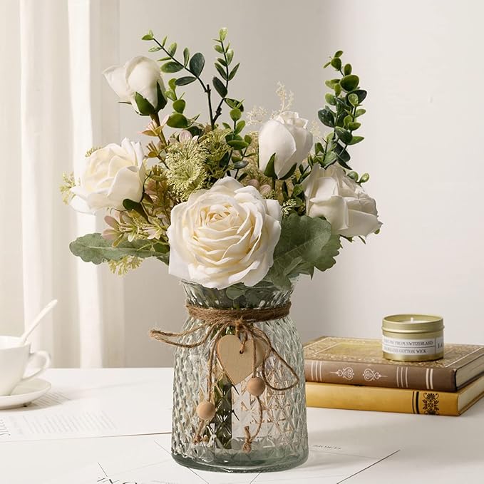  flower arrangement with white artificial roses, eucalyptus, and matching grass in a heart-shaped 