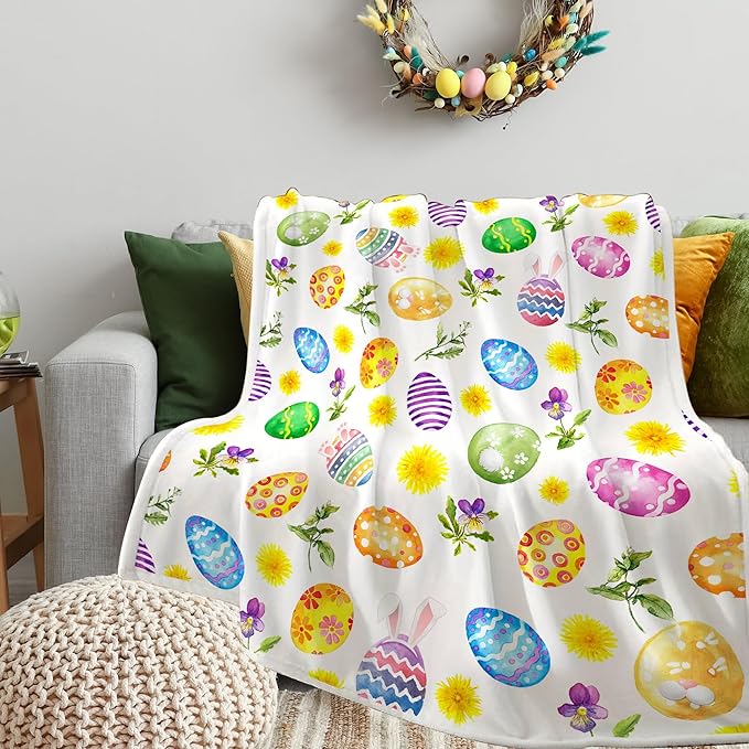 A soft, cozy flannel Easter-themed blanket with colorful egg designs, perfect for home décor
