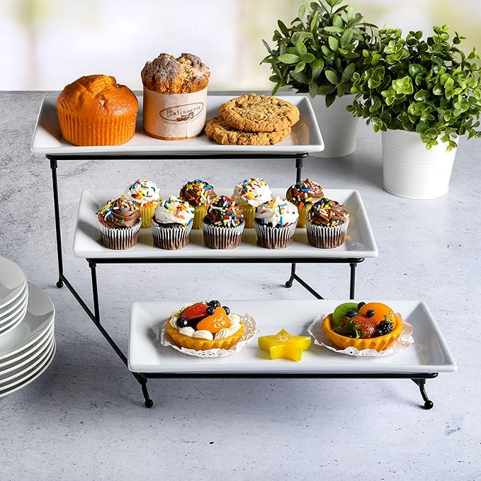 A sleek and modern 3-tier white porcelain plate set with a black metal stand, perfect for serving 
