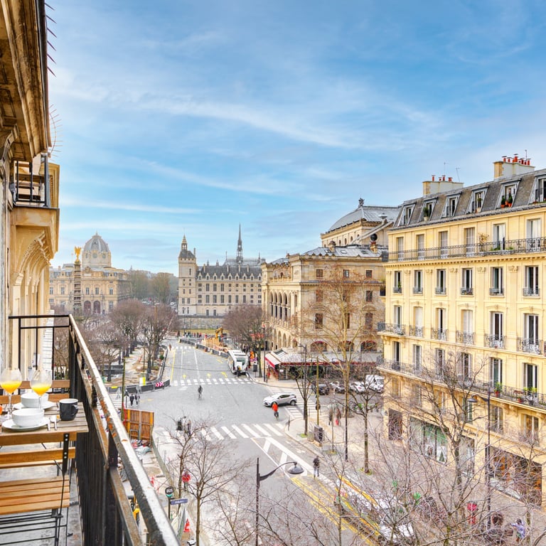 a balcony with a view of a city street