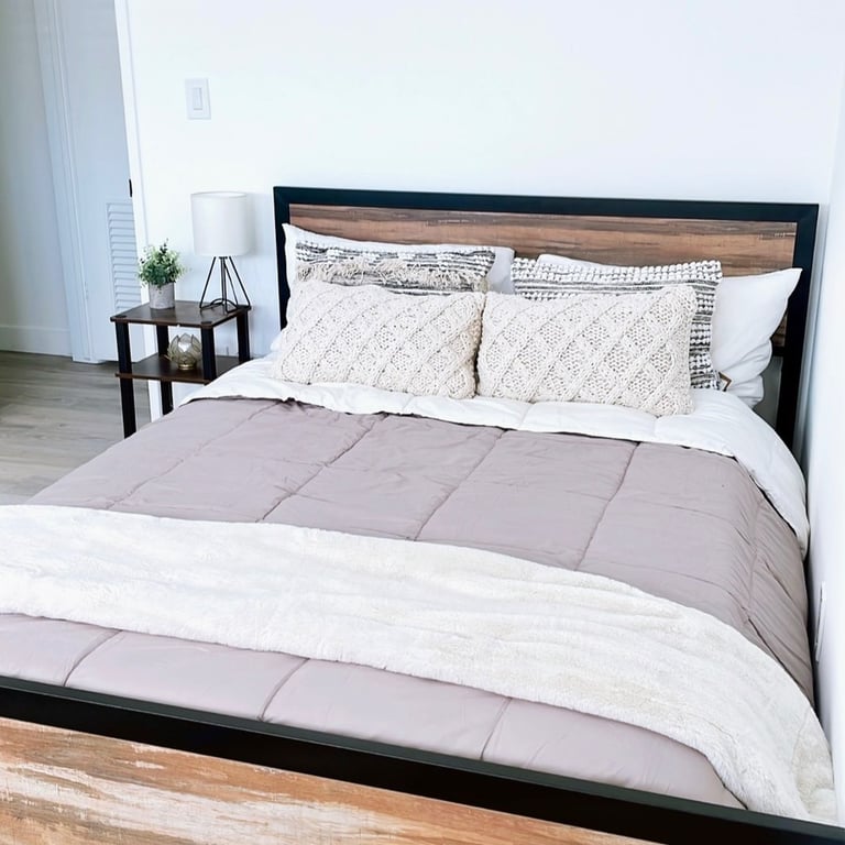 a bed with a wooden bed frame and a wooden bed