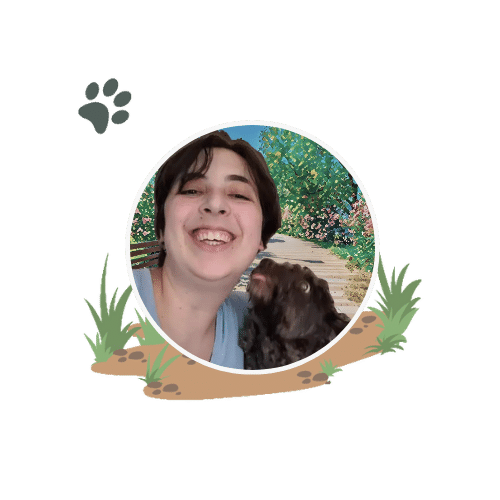 Julia Goldhirsh headshot in Boston Massachusetts with a black fluffy dog licking their face